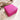 Stängt fuchsia mörkrosa travel size smyckesskrin i veganskt läder, kompakt reseskrin fotograferat i ljus miljö med drivved.