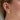 Öra smyckat med smal ear cuff i guld med stjärna.