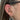 öra med ring i conch och litet piercingsmycke i forward helix